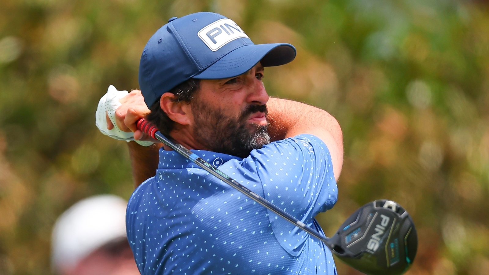 John Parry hits a driver off the tee