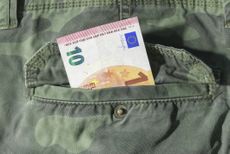 A 10 Euro note in a soldier's pocket representing EU defence spending