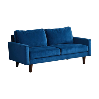 A blue mid-century modern velvet sofa