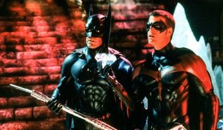 Batman and Robin face their threat while bathed in a red glow