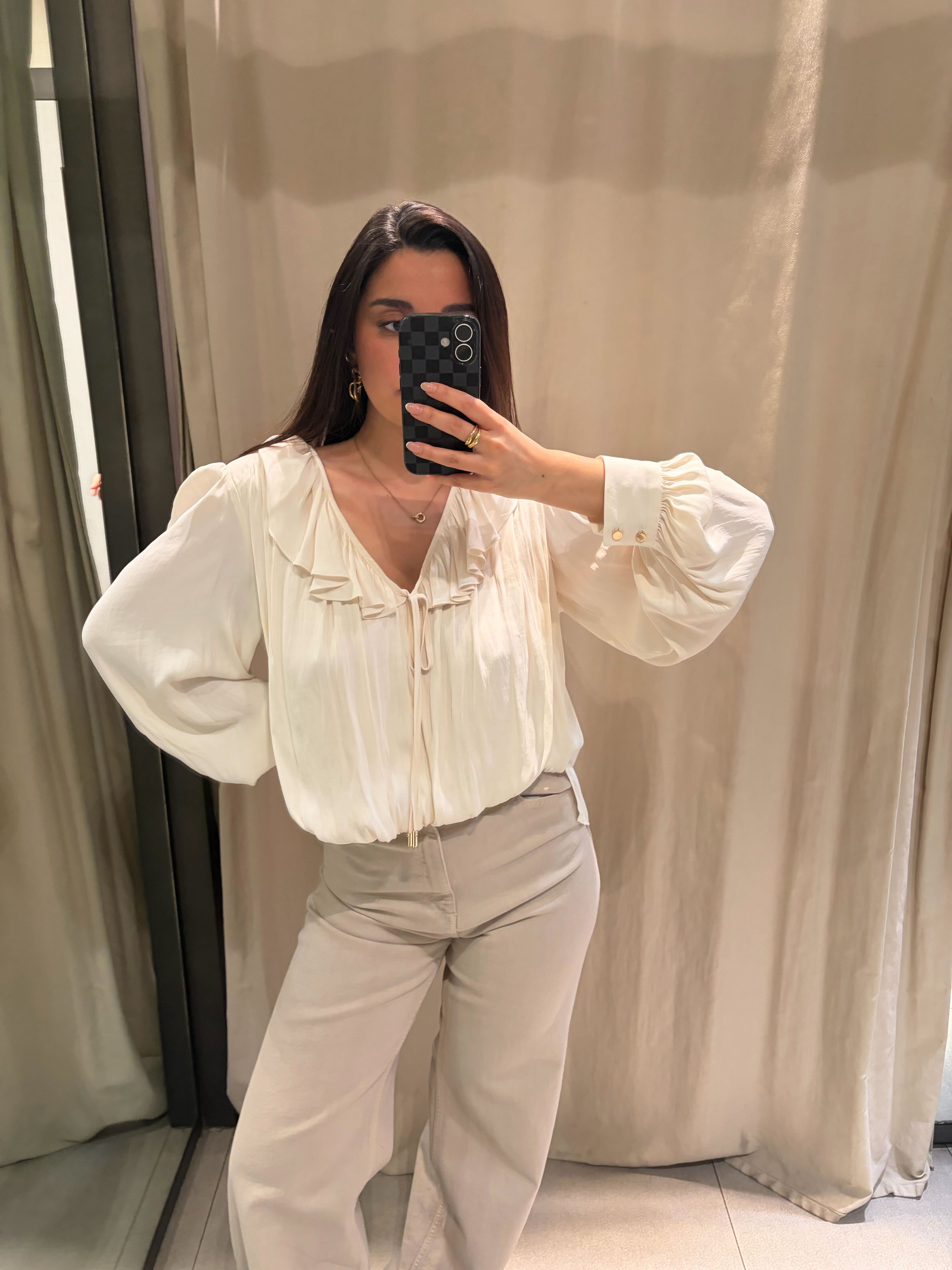 Marina trying on Zara