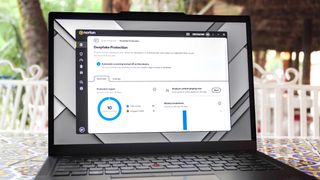 A laptop on a table running Norton 360 showing off Norton's Deepfake Protection feature