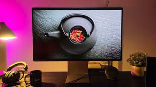 The Samsung Smart Monitor M9 on desktop in office environment with mood lighting