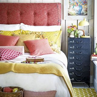 bedroom with red headboard