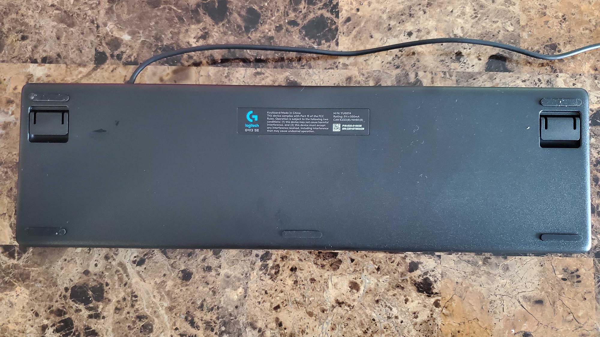 A Logitech G413 on a counter top