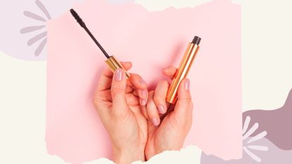 A woman's hand holding a mascara tube and wand learning how to apply mascara