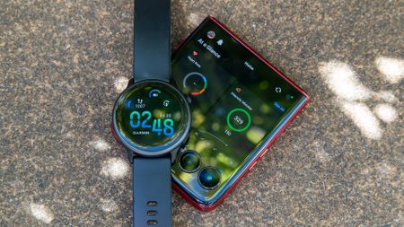 The Garmin Vivoactive 6 and the Razr Ultra 2025 with the Garmin Connect app open