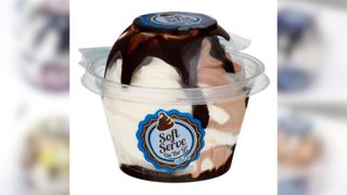 single serve plastic cup of vanilla ice cream with fudge in it