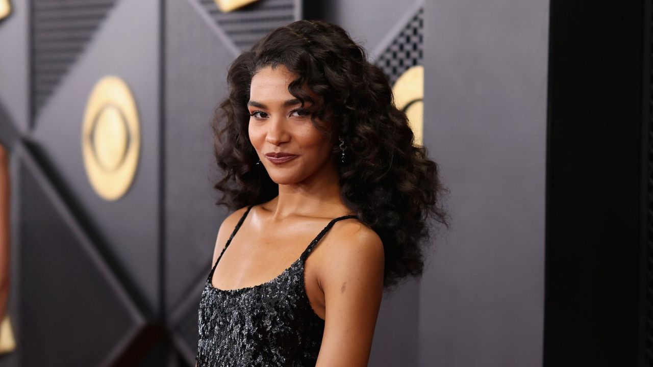 olivia dean on a black background