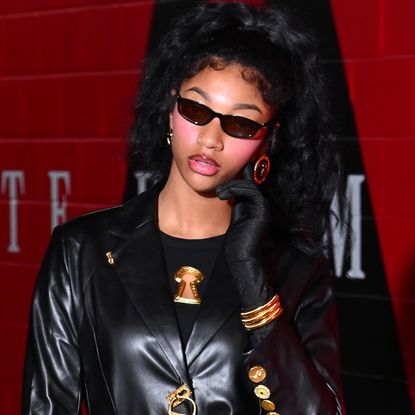 Angel Reese's leather Schiaparelli look included the capri pants trend and heels at Game 6 of the 2026 WNBA Finals