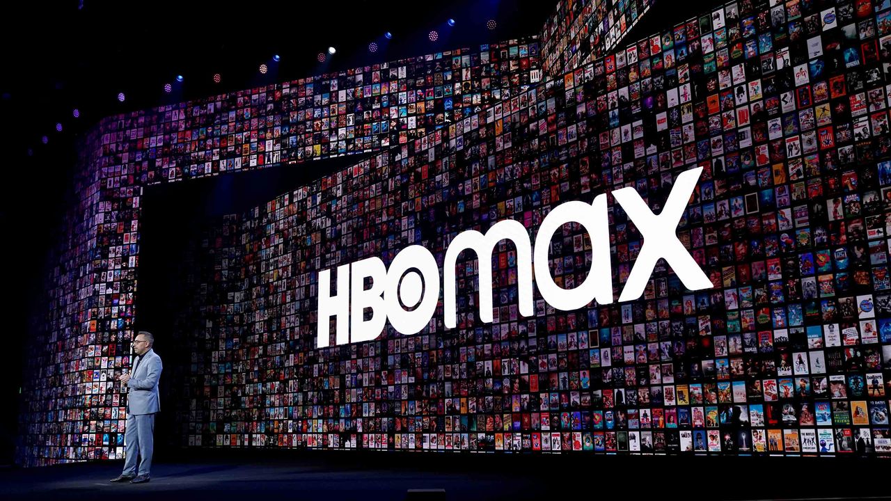 An HBO Max sign is shown in the background during an AT&amp;amp;T investor presentation