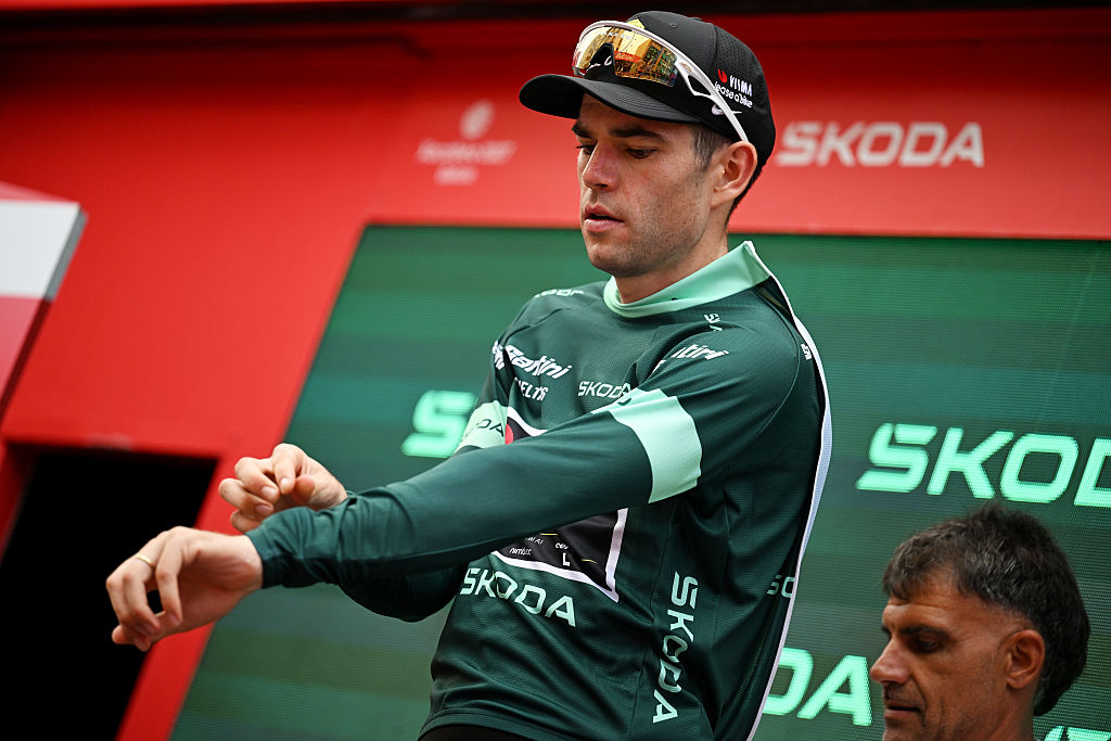 Van Aert donning the green jersey on the podium
