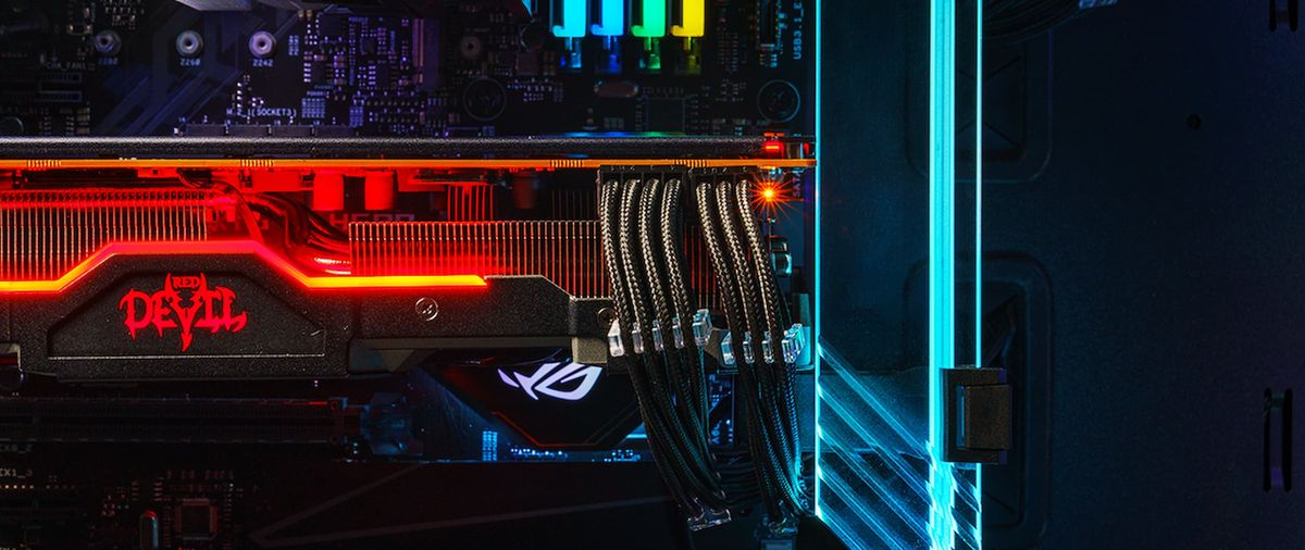 inside a PC with colored lighting, on the right is a blue glass gpu support bracket