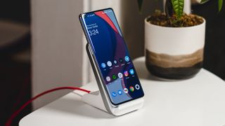 A OnePlus 9 Pro on the OnePlus Warp Charge wireless charger