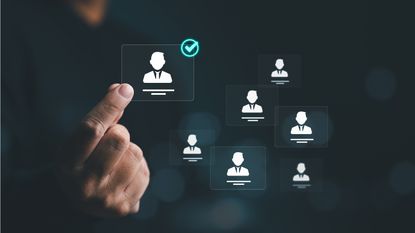 A hand chooses a digital figure from a selection of figures.