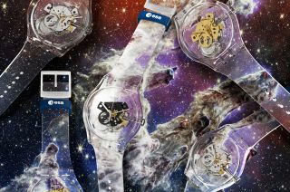 photo of five wristwatches against a backdrop that shows distant galaxies and stars.