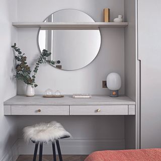 Grey floating dressing table in a bedroom