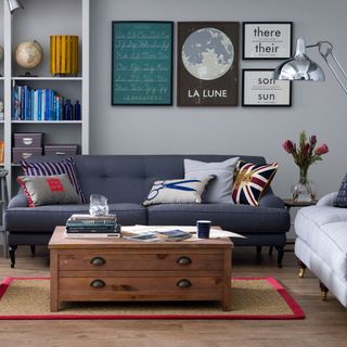 grey living room with sofa and wooden floor