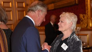 Prince Charles, Prince of Wales greets Dame Judi Dench during a reception at St James's Palace for British Oscar winners on May 4, 2016 in London, United Kingdom.