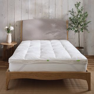 Bed frame with mattress and mattress topper