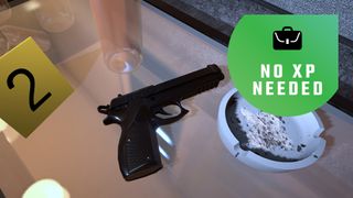 A gun on a table with an evidence marker
