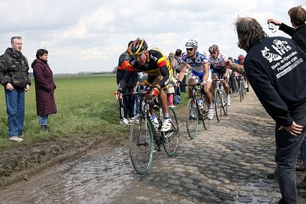 Stijn Devolder (Quick Step) leads his captain through one of the muddy sections.