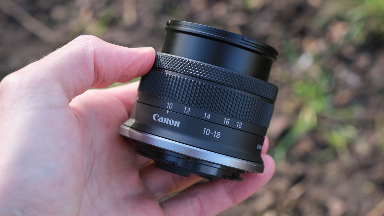 Canon RF-S 10-18mm lens held in a hand