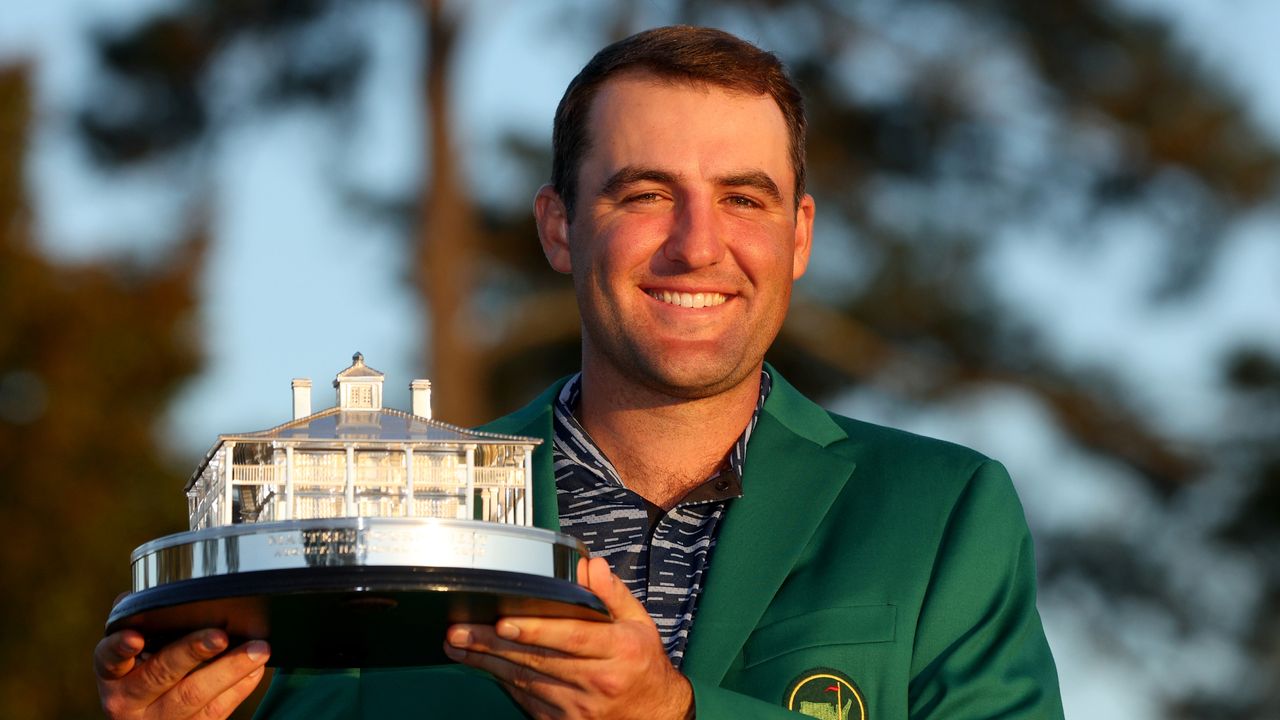 Scottie Scheffler holds the trophy after winning the 2022 Masters