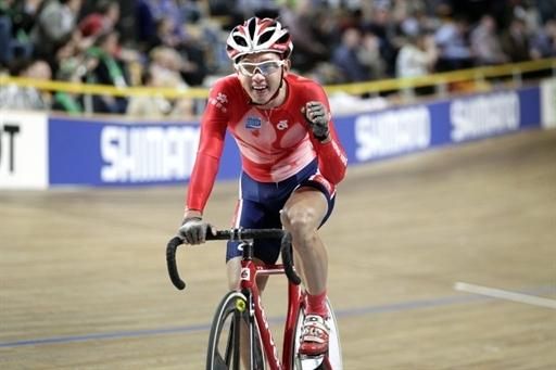 Ho Ting Kwok from Hong Kong reacts after winning the scratch race