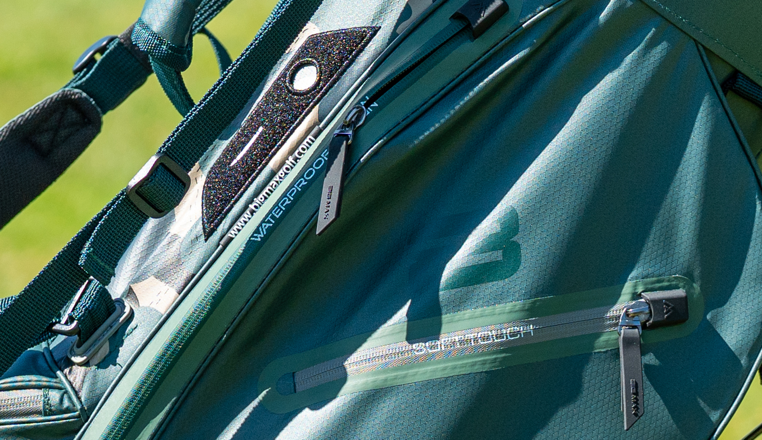 A close-up of the zips on the Big Max Aqua Eight H Stand Bag