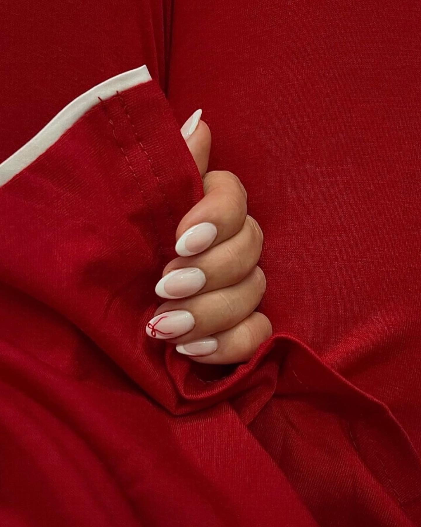 French manicure with bows.