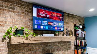 Vizio M-Series Quantum X 50” Class 4K TV hung on wall in living room