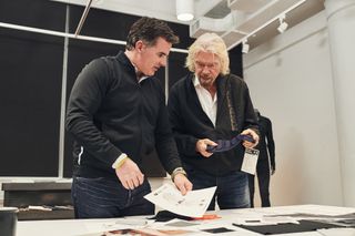 Virgin Galactic's Sir Richard Branson (right) and Under Armour founder Kevin Plank review possible apparel designs for Virgin Galactic customers and crewmembers.