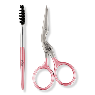 spoolie and curved brow scissors on a gray background