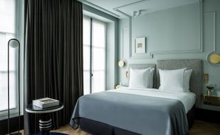 Maison Armance hotel guestroom with a blue/green interior in Paris, France