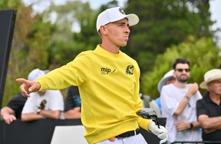 David Puig watches his tee shot