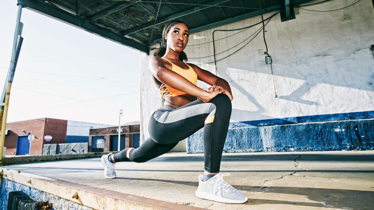 Woman stretching into a deep lunge