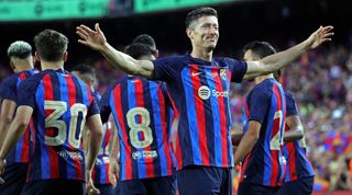 Robert Lewandowski celebrates a goal for Barcelona in the Gamper Trophy against Pumas at Camp Nou.