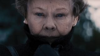 Dame Judi Dench stands in the open crying in Philomena.