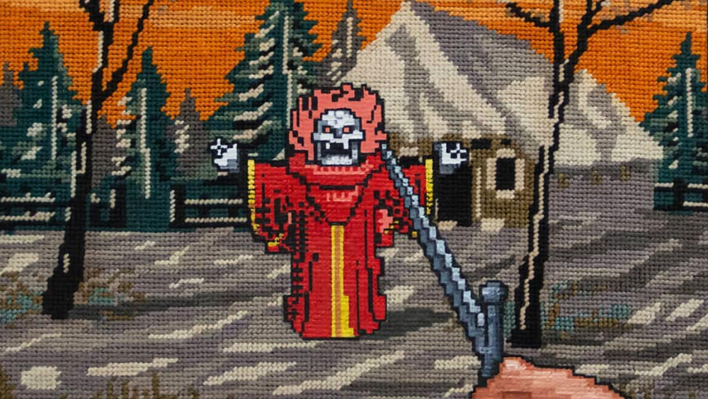 Embroidery that looks like pixel art from a video game showing a first-person player with a sword facing a demon