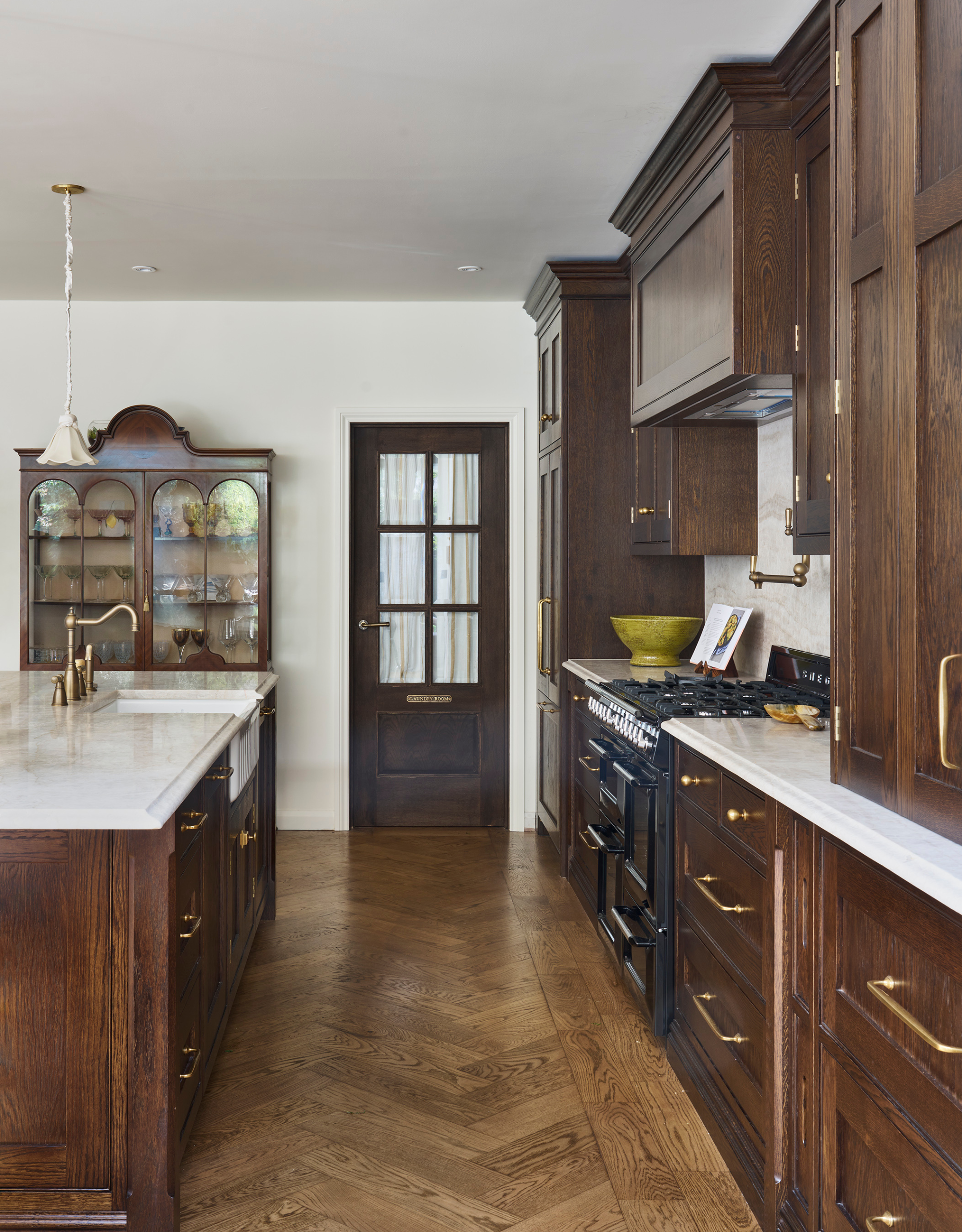 A modern, soulless kitchen transformed into a tradition, dark wooden design