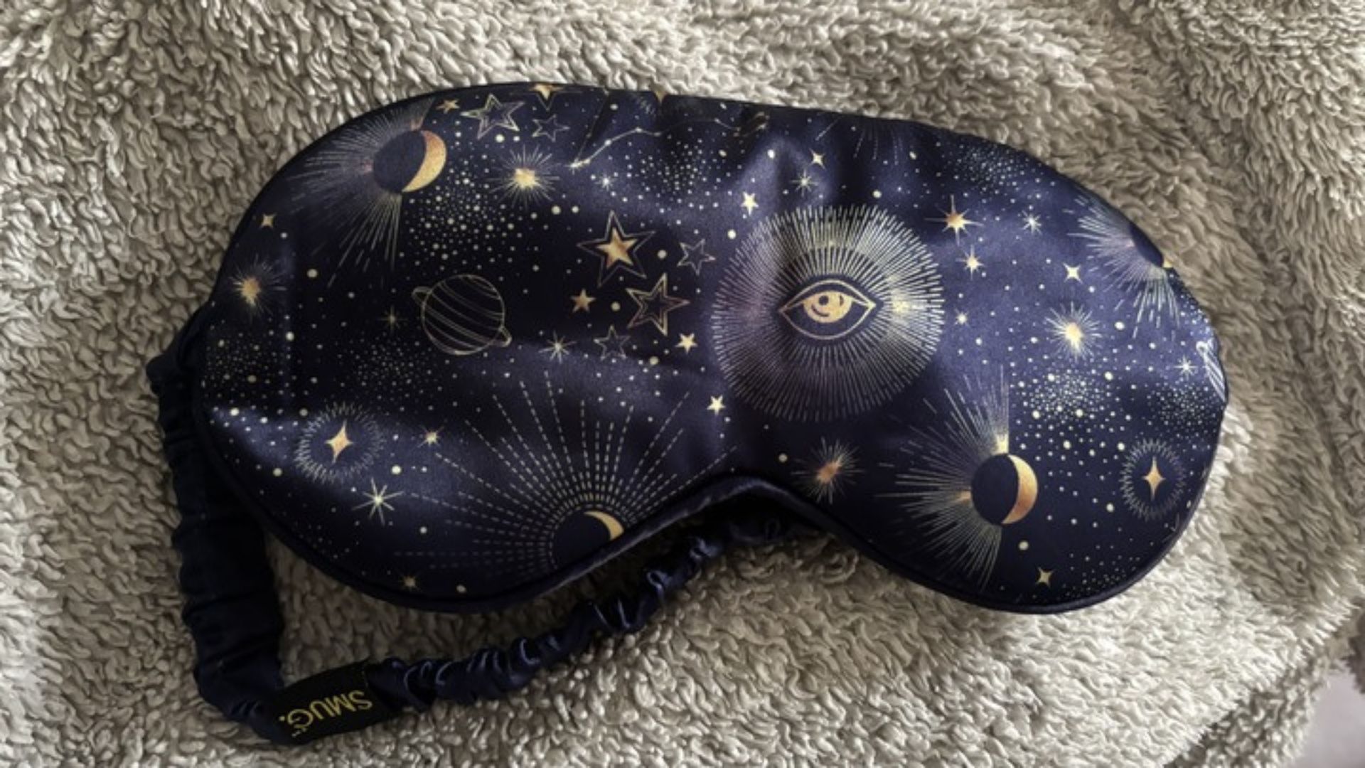 The SMUG Satin Sleep Mask in a celestial design.