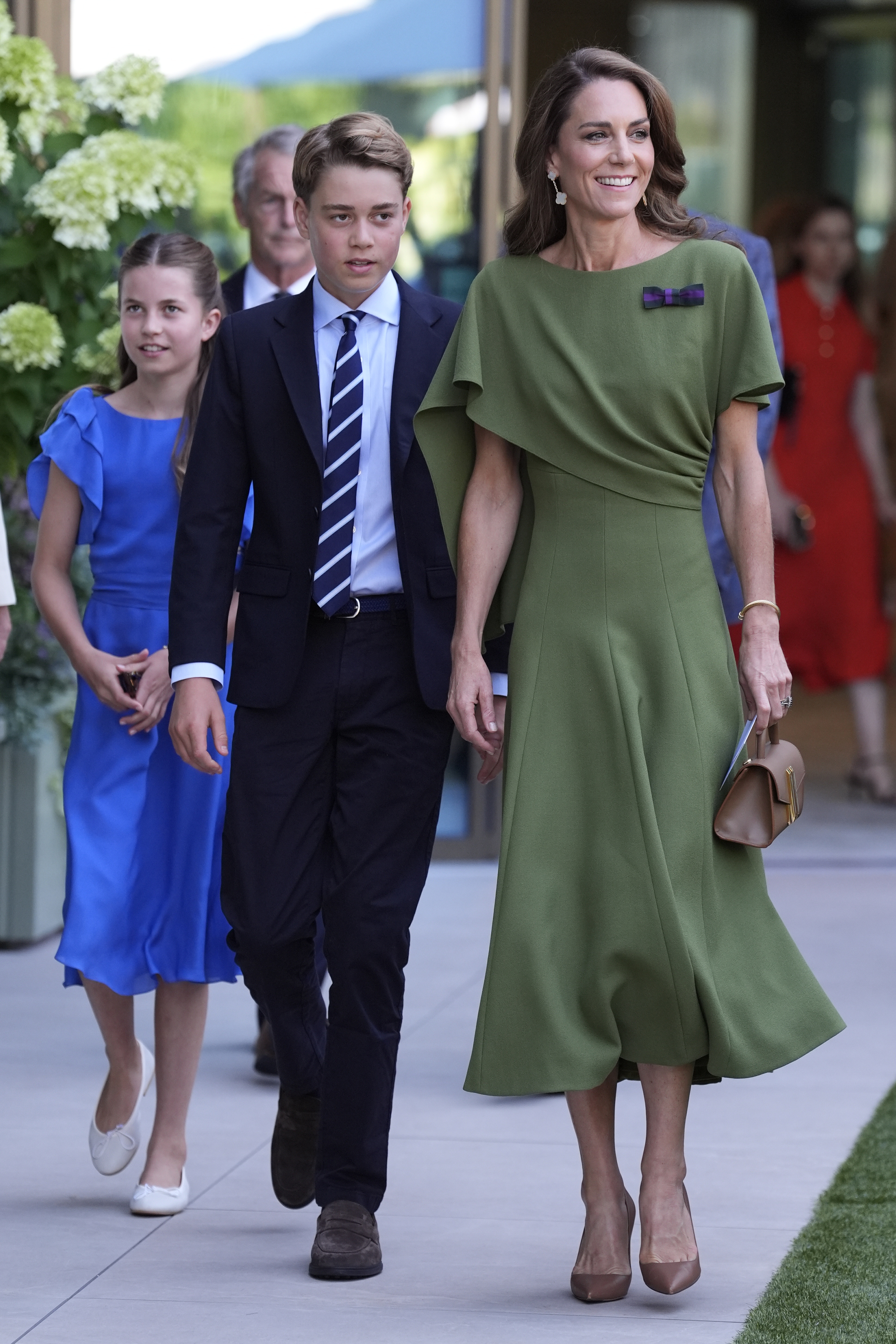 Princess Kate, Prince George and Princess Charlotte walking in a row at Wimbledon 2026