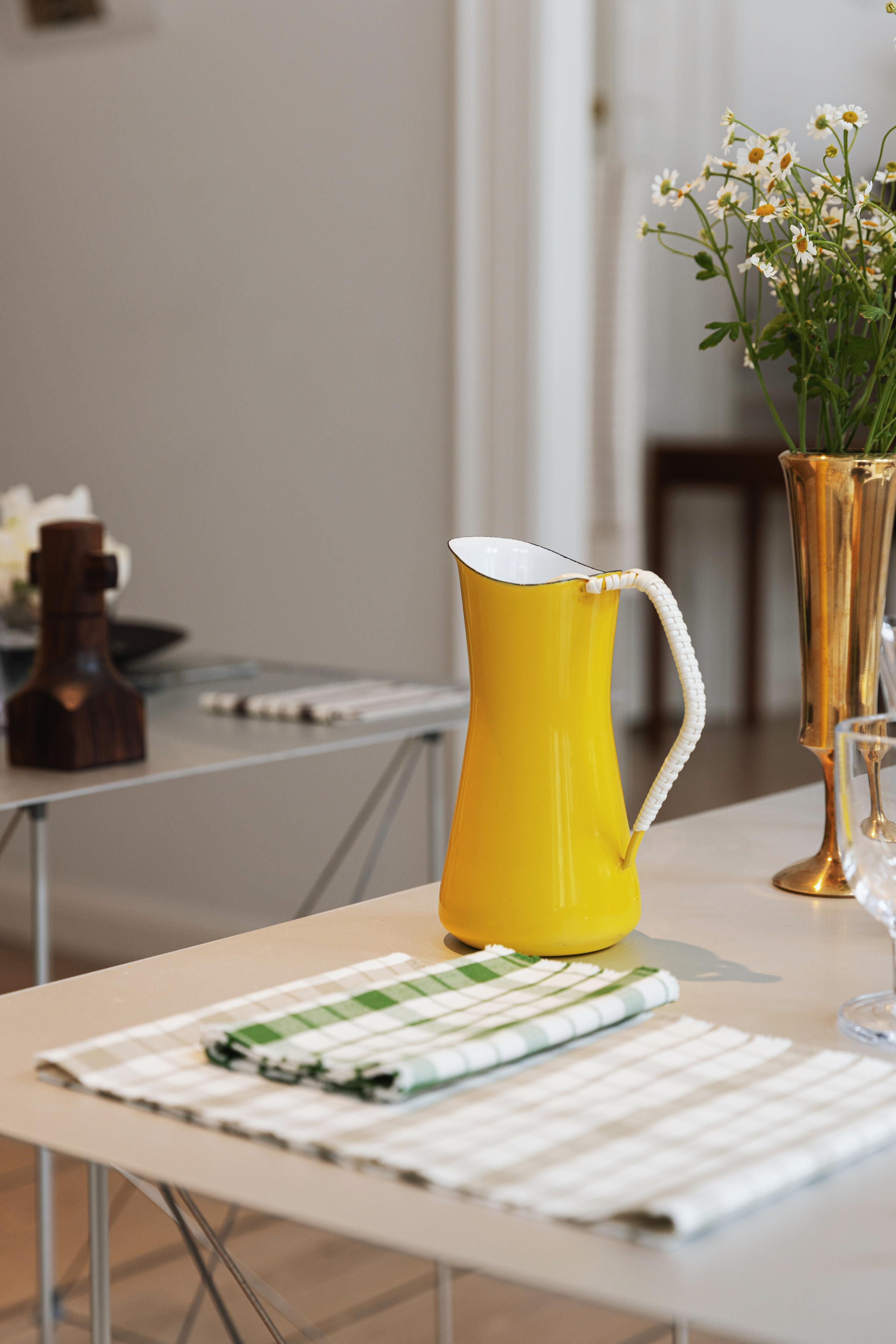 Yelllow jug and checkered napkins