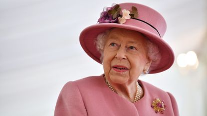 Britain's Queen Elizabeth II speaks with staff during a visit to the Defence Science and Technology Laboratory 