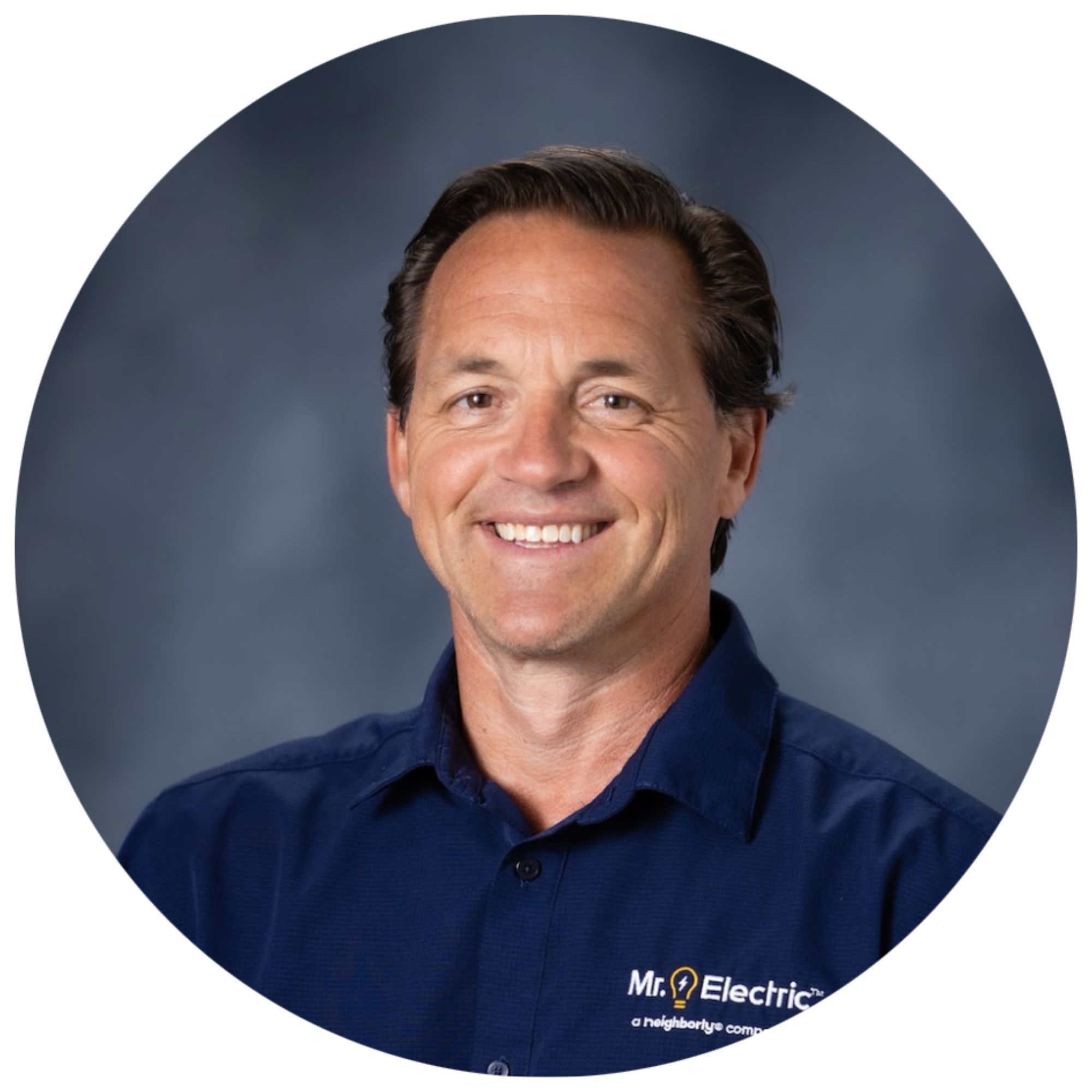 A headshot of Ben Kolo in a blue top