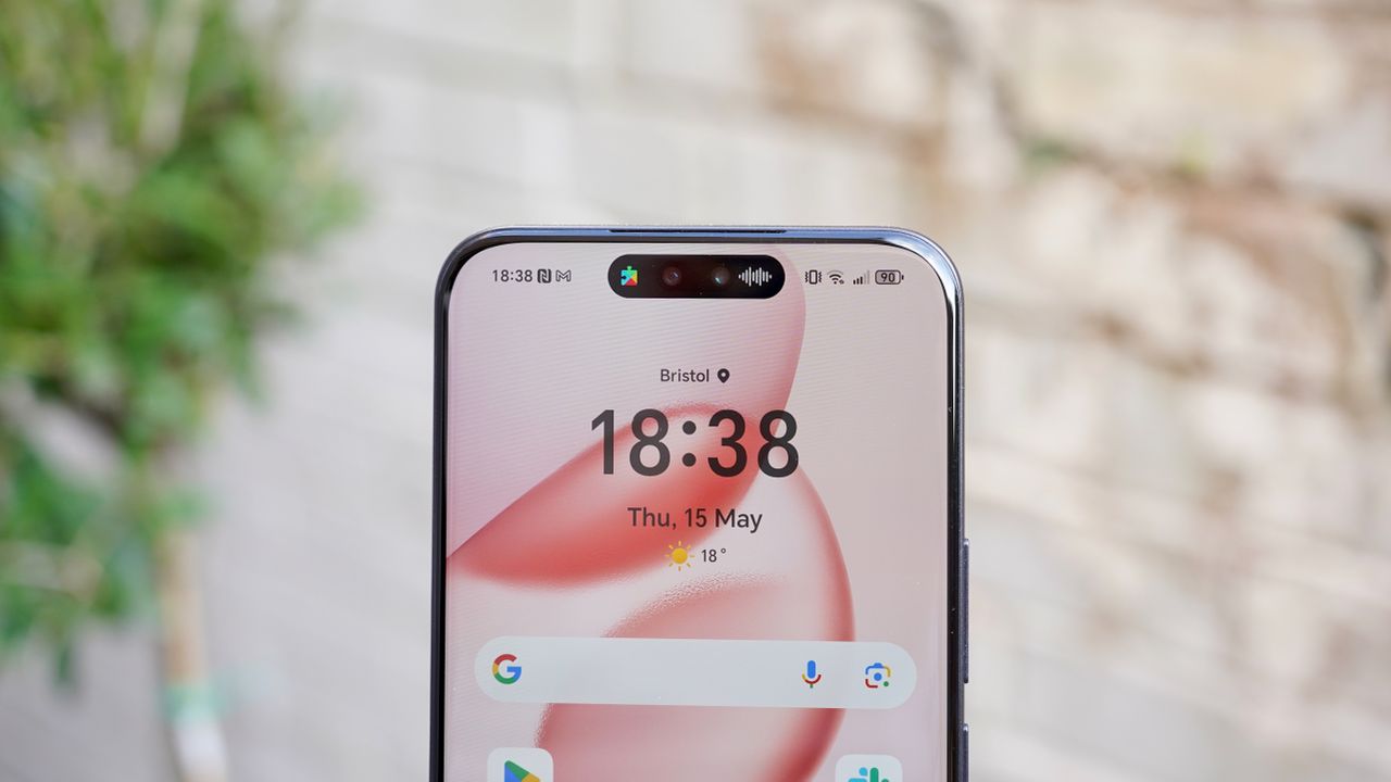 The Honor 400 Pro against a wall focusing in on the front-facing camera