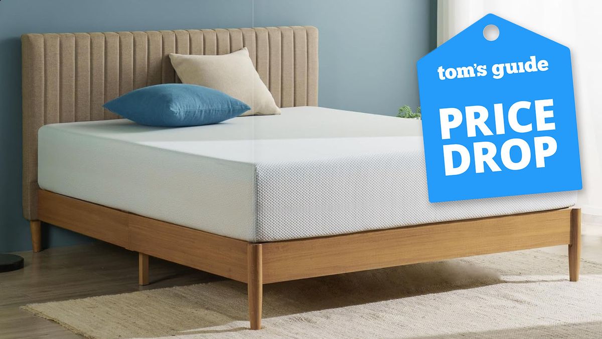 The Zinus Green Tea 10-inch Memory Foam Mattress on a wooden bed frame in a bedroom, a Tom&#039;s Guide price drop deals graphic (right)