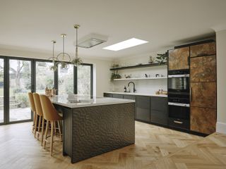 A transitional style kitchen using metal to create texture