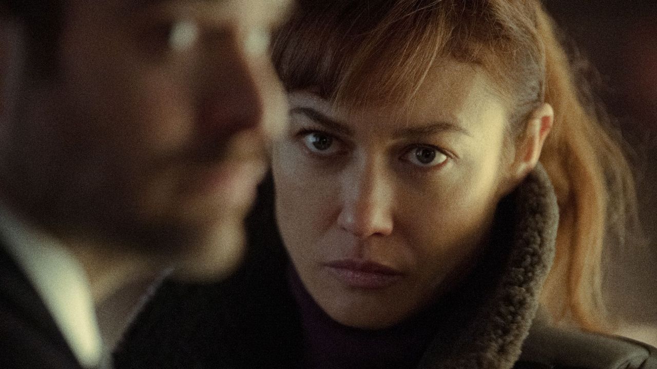 A close up shot of Kara staring intently at Adam Lawrence in Treason on Netflix
